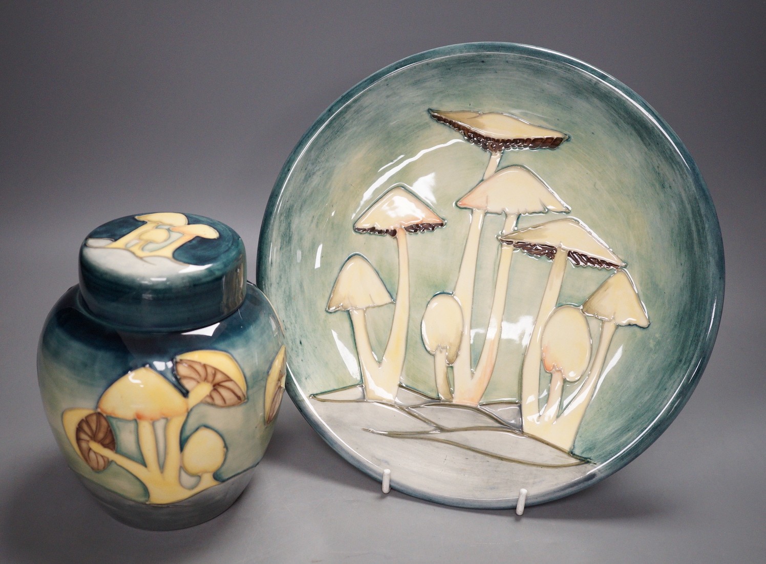 A Moorcroft pottery dish and ginger jar and cover, each decorated with the 
